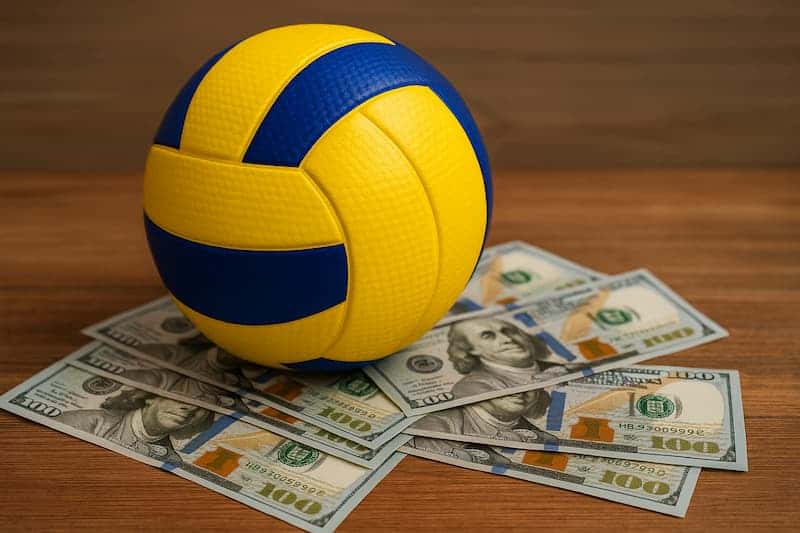 Bola de vôlei sobre notas de dinheiro representando apostas esportivas